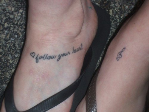 My first tattoo ( Follow Your Heart) on my left foot. The music note is my 