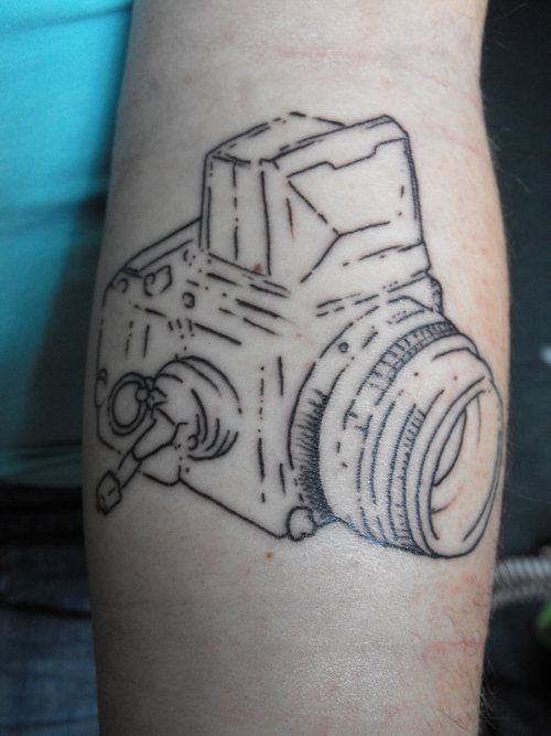suz camera tattoo
