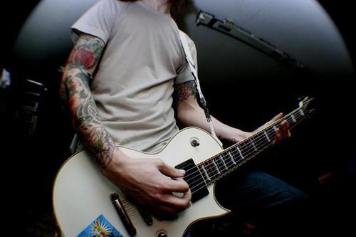 rrifhann gotta love tattoos and guitar