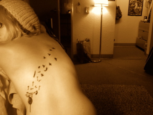 dandelion tattoos. It#39;s a dandelion blowing away