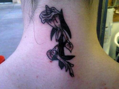 calla lilly tattoos. with a calla Lilly wrapped