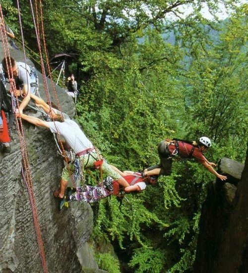 Extreme Rock Climbing Teamwork