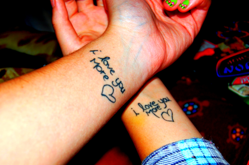 Mine and my sister's matching tattoos. Mine(left) is in her handwriting and 