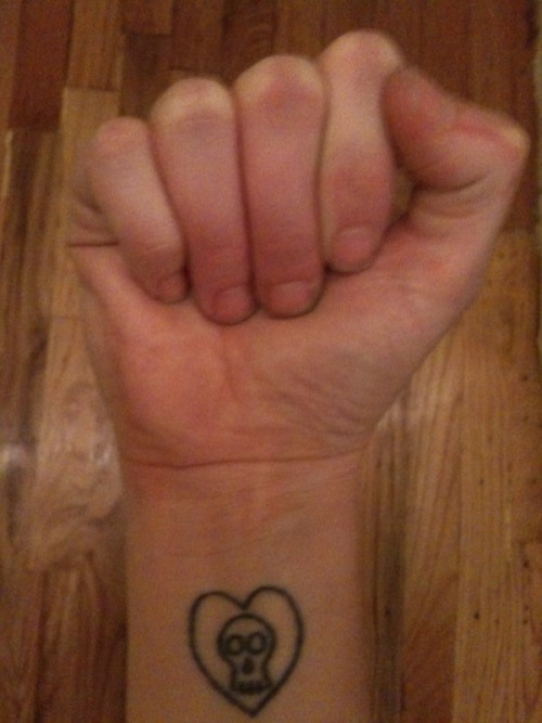 For my first tattoo, I accidentally got the Alkaline Trio logo tattooed on 