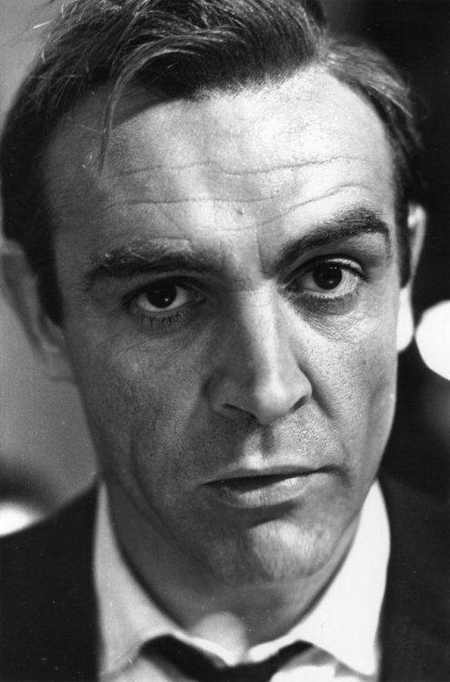 Oriana Fallaci: So then, Sean, let&#8217;s finish with a little test: the names of three men &amp; three women whom you admire, for whom you feel respect &amp; envy.  Sean Connery: The first is Khrushchev. That sense of humor of his, that appetite for living, that non-conformism. Great man. The second is Stanley Matthews, the soccer player. He&#8217;s 51, and still plays soccer. I&#8217;d like to be him. The third is Picasso: to me he has the same virtues as Khrushchev.  As for women&#8230;let&#8217;s see&#8230;women&#8230;let&#8217;s see&#8230;odd: you know, I can&#8217;t think of a single one? Yet I like them a lot, I respect them, I esteem them, I often find them superior to men. I&#8217;m one of those who still find women devilishly attractive, irreplaceable&#8230;well, that must be why. I mean that, whenever I see a woman, I can never get away from the sex element. The liking and even the admiration, even the respect, I feel for a woman always has sexual origins. A character like me, who loves life, appetite, and strength, can&#8217;t get away from sexual desires. And so, when he stops to assess a woman, he can never make out where that thing finishes and pure admiration begins. Do you see what I mean? Khrushchev doesn&#8217;t provoke any sexual desires in me, nor does Matthews, nor does Picasso. With them there isn&#8217;t that alarming little complication. Alarming. Isn&#8217;t it?  Fallaci: Eh, yes. Alarming.  Connery: In fact, I find women very alarming, very worrying. Always. And picking out one I admire and nothing else&#8230;let&#8217;s see&#8230;yes: Greta Garbo. For her talent, her dignity, her silence. And yet, no, even in her case I can&#8217;t get away from the fact that if I&#8217;d ever been close to her&#8230;well&#8230;in short&#8230;I&#8217;d have been very attracted to her, apart from her talent, her dignity, her silence. So, after all, the choice doesn&#8217;t stand. Phew! Tell you what we&#8217;ll do: we&#8217;ll forget about the women for a moment and take the names of two more men. One is Hitchcock and the other is Noel Coward. And now let&#8217;s go and have a beer.  -Paris magazine, March, 1965