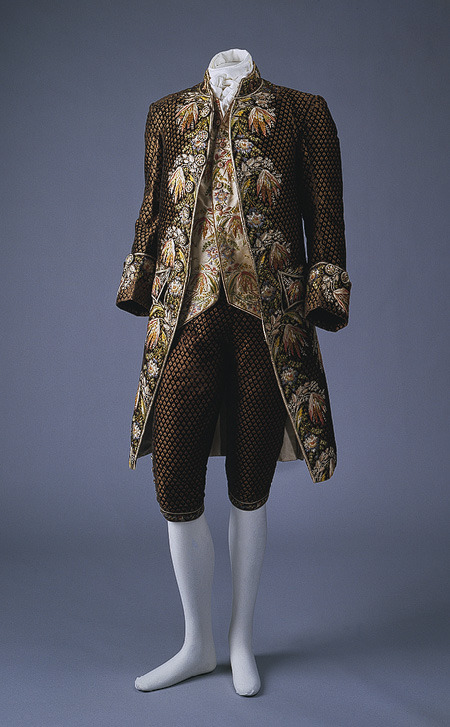 Suit, 1774–92French (Paris)Silk”The embroidery with silk floss was executed à la disposition, created in predetermined pattern shapes, thus to accord fully with the silhouette and outlines of the suit. Even the embroidered buttons reiterate on a secondary scale the florals of the jacket.”  via - Met Museum