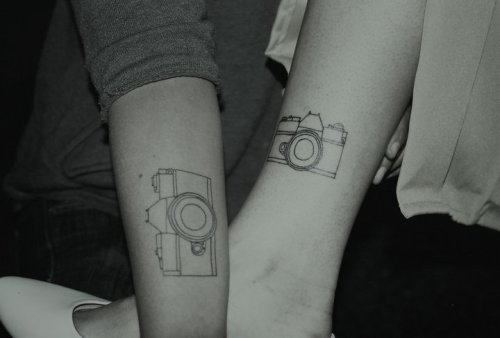 My best friend and I got matching camera outlines done together