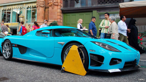 Parking wardens clamped two unique supercars outside London's Harrods 