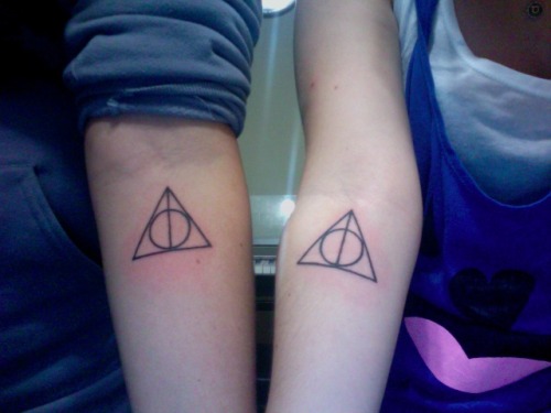 fuckyeahtattoos:  my friend and i got these to symbolize our deep and undying love for harry potter. we’ve grown up with the story, and will always remember it as an integral part of our childhood.   :D 