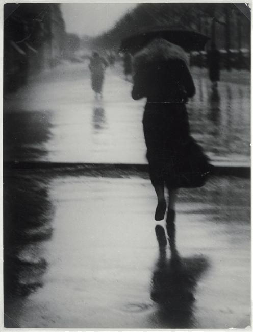 Passers-by in the rain, 1935 by Brassai
from RMN