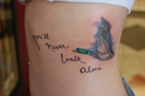 tattoo writing on ribs