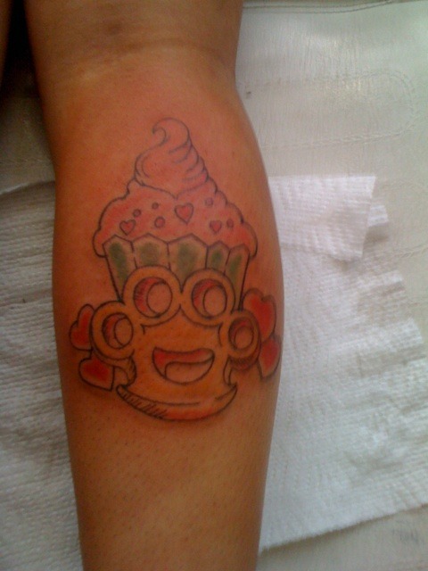 cupcake brass knuckles tattoo done by me :)