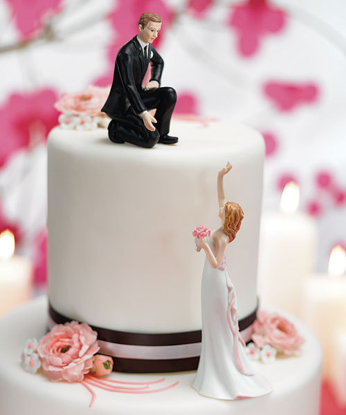 There are SO many adorable wedding cake toppers I think this one is 