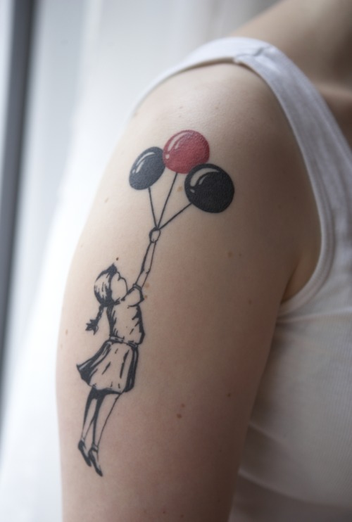 It is based on a street art by Banksy and I absolutely love what the tattoo