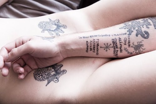 He tattooed all of her conditions on his inner arm and that is the writing 