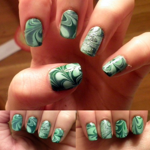 thenailpro:

st. patricks day nails one of two! water marbling!
colors used:
sally hansen-mint sorbet
color club-twiggie
american apparel-hunter
