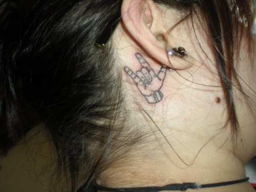My fourth tattoo I love you in sign language behind my right ear