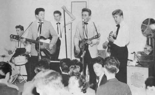 all-we-are-saying:

First known photo of John &amp; Paul performing with The Quarrymen.
