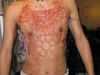 scarification tattoo. full torso scarification