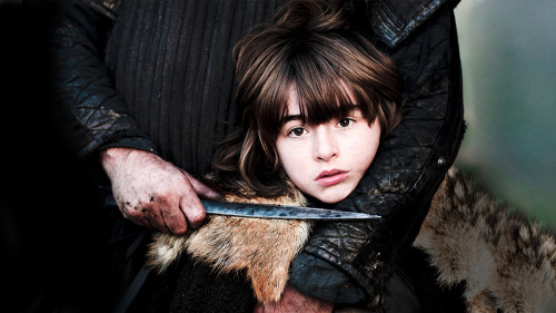 Bran is held by a wildling with a knife to his throat