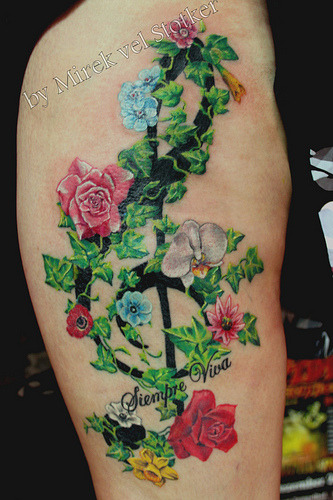 clef with flowers and ivy tattoo Artist Mirek vel Stotker