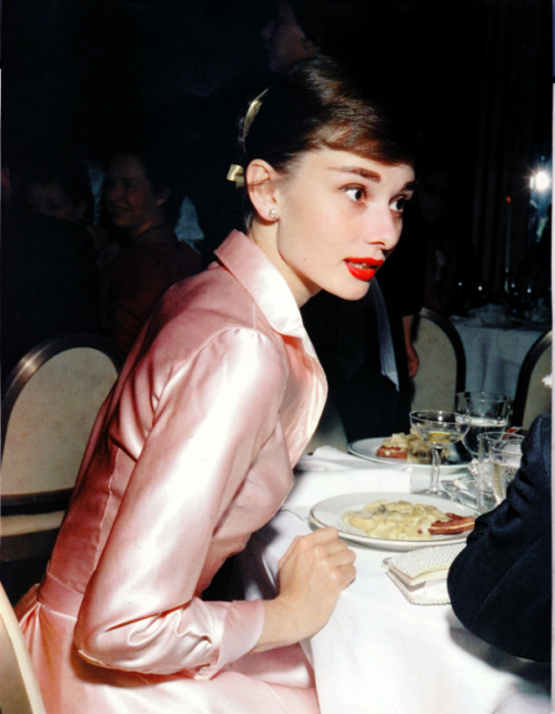 Audrey Hepburn at the Lido Nightclub in Paris,France. December 19, 1955