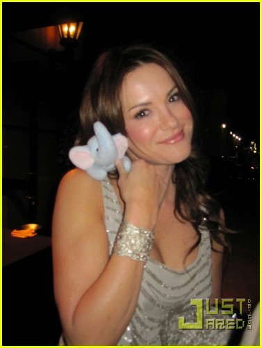 Danneel Harris holding an elephant beanie baby to support The 