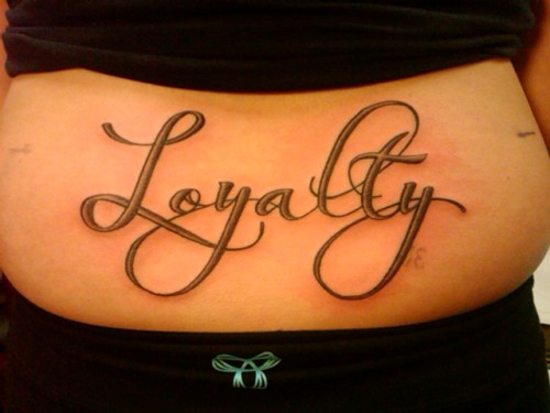 Tagged lettering tattoo lower