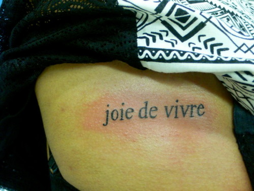 Tattoo number 2'joie de vivre' on my ribs in times new roman