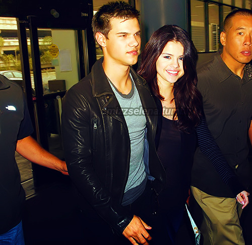 
 Taylor Lautner and Selena Gomez departing LAX
