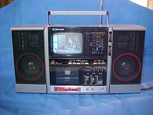 darthchaosrspw:

I used to own one of these. It’s an Emerson XLC-555 boombox. It had a cassette recorder, AM/FM radio, and a 5 inch B/W television. I loved the shit out of mine until the sound started to short out. I even used to watch cable TV on mine. :D
