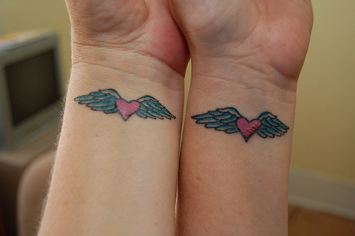  heart matching wings tattoo