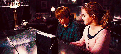 perksofbeingapotterfan:


“Be a bit gentle”

 #i’ve missed this #so much #hermione shows she cares by sharing her knowledge. in this instance she isn’t the overbearing knowitall everyone assumes she is. #she smiles and teaches in a nurturing way #she’s enthusiastic about sharing a part of herself #and ron. oh ron… #all i need to say is just look at his face. all thoughts are gone from his head except the one he finally found. #it took him so long to realize that he loved her. and now that he’s conscious of that her can’t force himself to unsee all of the beauty … #not just because she’s pretty. but because her eyes light up when she does something she loves. #all of the beauty inside and out. and has been in front of him this whole time.
