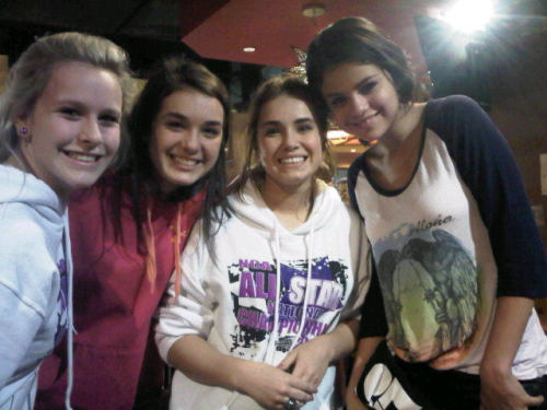 Selena Gomez with fans at the airport in North Carolina 