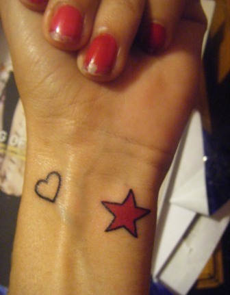 My 2 tiny tattoos The love heart is for my 5 sisters we 