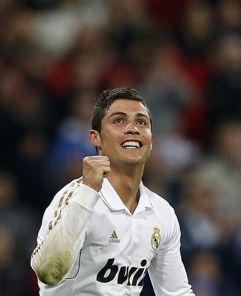 Your lovely smile is contagious  ♥
Real Madrid vs. Sporting Gijon 3:1, 14.04.2012(via Photo from Reuters Pictures)