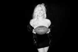 Lady Gaga holding a football…Go Pats!
